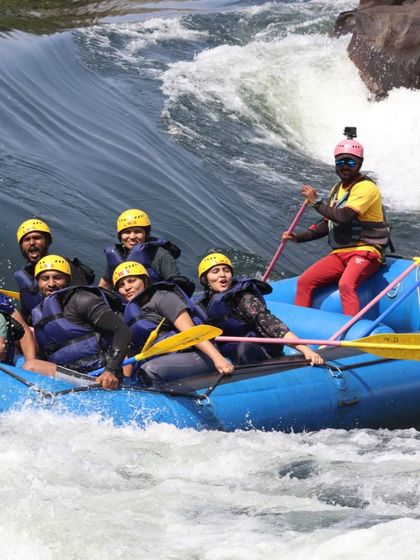 Another exciting moment of white water rafting, with everyone paddling together.