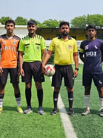 The captains and officials line up before the U15 match between Fast FC and YFI.
