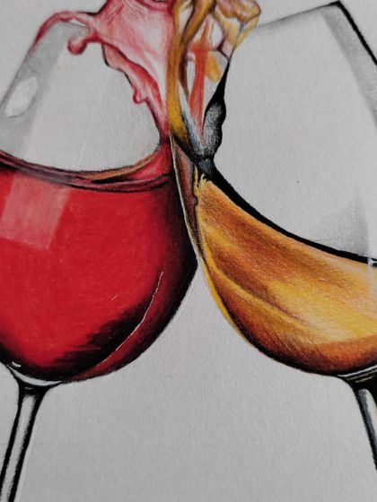 A close-up of the splash where the two wine glasses meet, showing the mix of colors and the sense of motion.