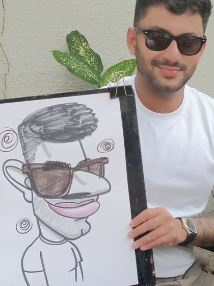 This guest's sunglasses and confident pose made for a very cool caricature.