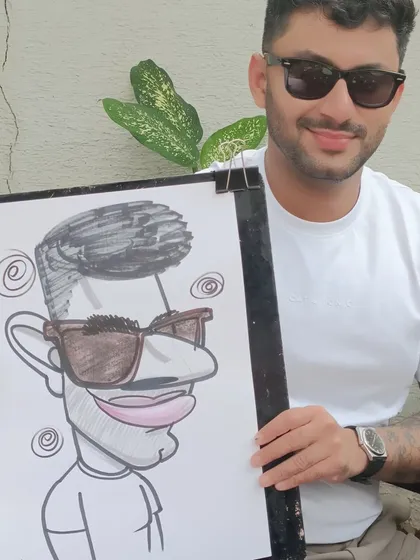 A cool guest with sunglasses, and a caricature to match, from a New Year's celebration at Elephant and Co. in Koregaon Park.