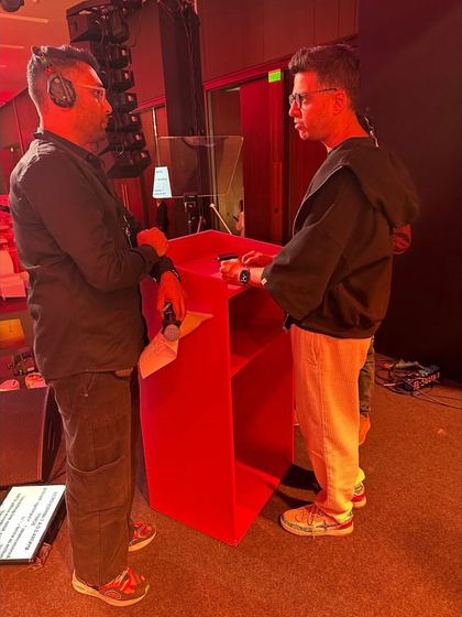 Our show caller coordinating with the host, Rohan Joshi, backstage at the Myntra G.O.A.T. Awards.