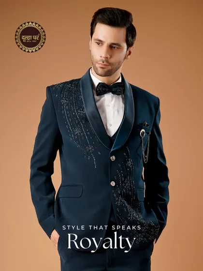 Style that speaks royalty. A full view of the navy tuxedo, showcasing its complete silhouette and confident stance.