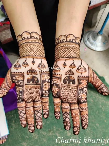 A beautiful design for Karwa Chauth. This intricate pattern features elephants, hanging bells, and floral details, perfect for celebrating the festival with traditional elegance.