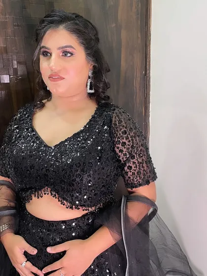 A final look at this beautiful party style. The makeup is bold yet elegant, perfect for a night out.