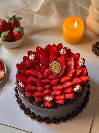 Another view of our Chocolate Strawberry Cake, highlighting the abundance of fresh strawberries covering the rich chocolate ganache. It's a truly indulgent way to celebrate strawberry season.