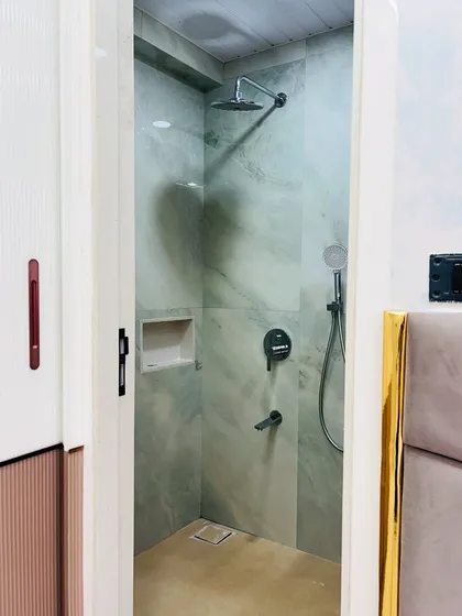 A view from the bedroom into the attached bathroom, showing how the design complements the overall aesthetic of the home.