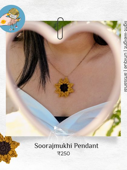 My 'Soorajmukhi' pendant, seen through a heart-shaped mirror. It's like wearing a little piece of sunshine.