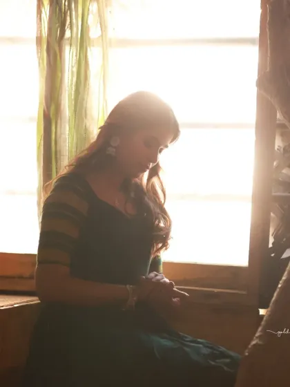 Portraits of a model in a green dress, captured in a traditional house setting. The warm, earthy tones of the location complement the outfit and create a peaceful, grounded mood.