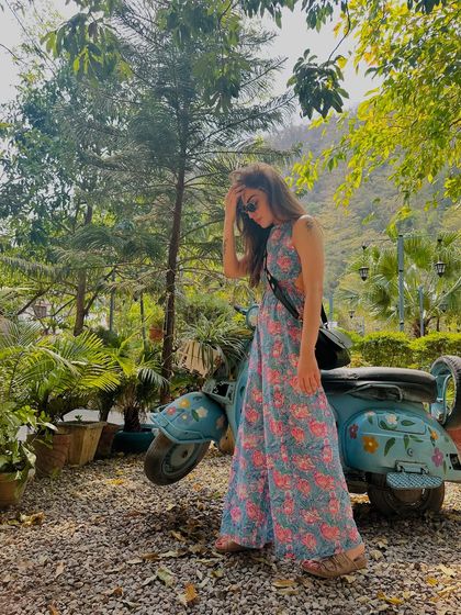 A candid moment in Rishikesh. This floral jumpsuit was the perfect choice for exploring the vibrant and scenic town.