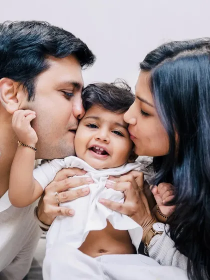 Kisses from both mom and dad for their happy little one. My goal is to create images that you will look back on with warmth and nostalgia, remembering the love that filled your home.