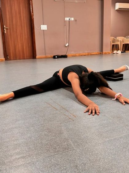 Our students are always growing. These images capture their progress in flexibility and technique, from deep splits to high extensions at the barre, with guidance from our teachers.