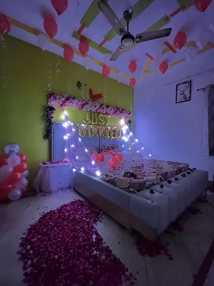 A full view of the decorated room, including balloons on the ceiling.