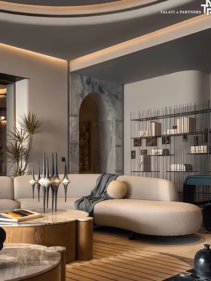 The living room at Palais Royale is a study in balance, scale, and restraint. The design works with the unique hexagonal footprint to create a flow that feels both dynamic and seamless, with limewash-painted walls and tempest white marble flooring setting a tone of quiet luxury.