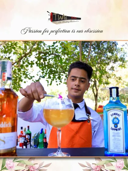 A flaming cocktail being prepared at an outdoor brunch in Alibag, adding a touch of drama and excitement to the daytime celebration.