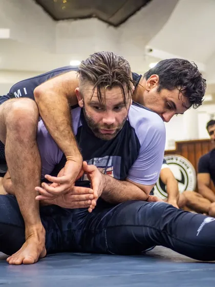 The devil is in the details. Here, BJJ black belt Mike Murrell demonstrates the precise hand-fighting and control needed to secure a seatbelt grip, a fundamental position in submission wrestling and MMA.