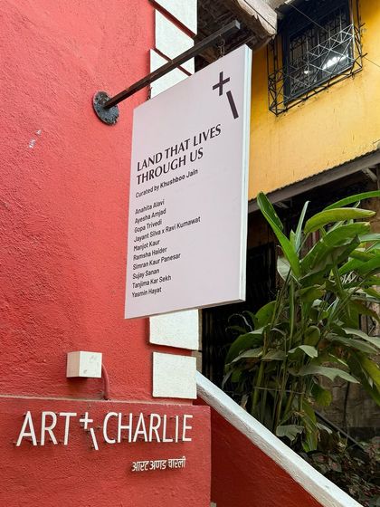 The sign for the Art & Charlie gallery in Bandra, a key part of my art-hopping adventure.