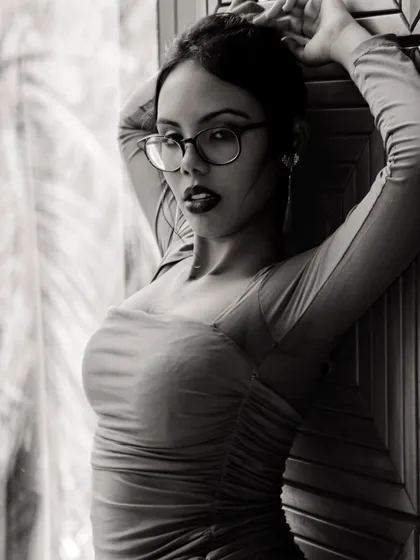 The same look translated into a dramatic black and white portrait. The bold lip and defined eyes create a powerful, high-contrast image.