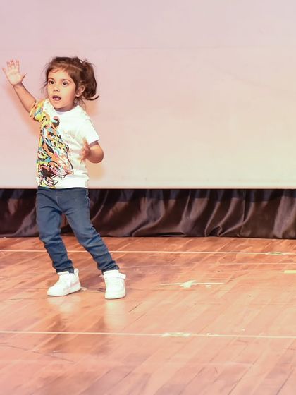 A candid shot of Dea mid-move, showcasing the dynamic energy she brings to her performance.