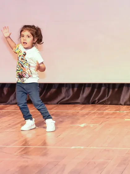 A candid shot of Dea mid-move, showcasing the dynamic energy she brings to her performance.