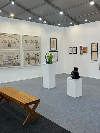 A wide shot of the booth, showing the spacious and well-lit environment we create for viewing art.