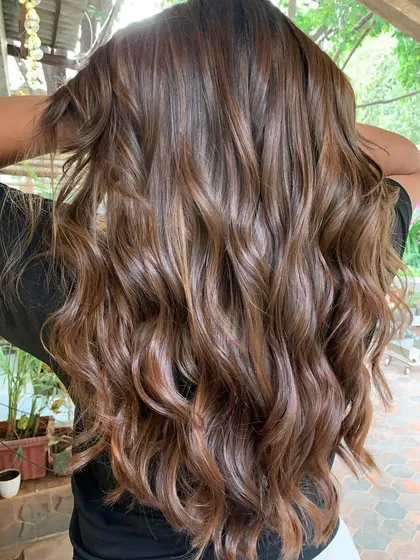 Another angle of the 'Betel Nut' look, showing off the long, healthy, and beautifully colored hair.