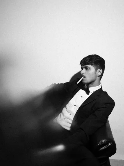This classic black and white portrait was created with a simple one-light setup. By placing the light directly in front of the model, I created a dramatic, high-contrast look perfect for a powerful headshot or model portfolio.