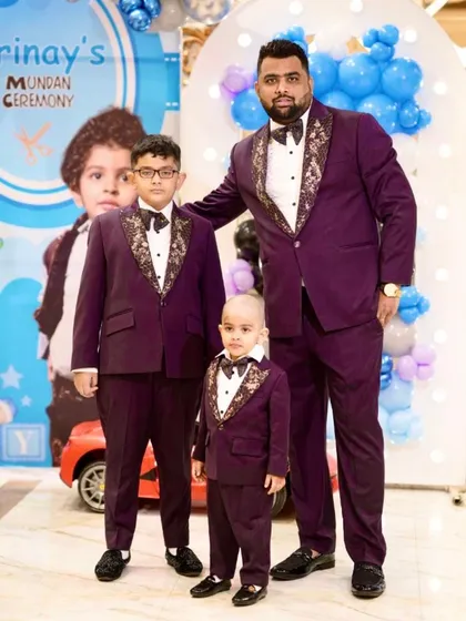 It’s always special to dress the entire family. Here’s a proud father with his two sons in matching custom-made purple tuxedos for a family function. Coordinating outfits for the groom's crew or family is something I specialize in.