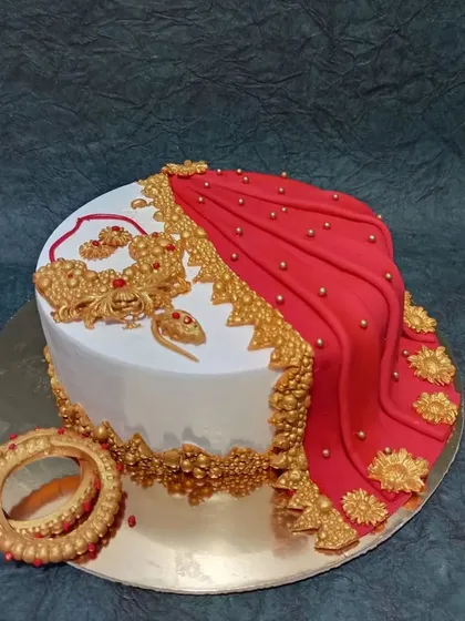 Celebrating tradition with a modern twist, this saree-themed cake is one of my favorite creations. The detailed, edible fabric draping, intricate gold jewelry, and floral patterns make it a beautiful centerpiece for cultural celebrations.
