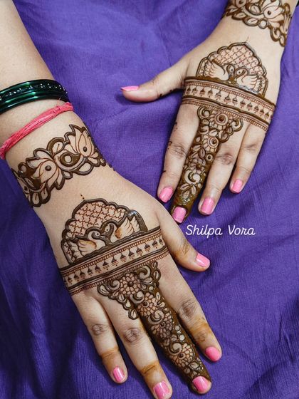 Simple yet elegant peacock and lotus cuff designs, perfect for someone who wants a minimal but traditional look.