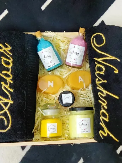 I just love this black and gold theme for a modern couple. This wedding hamper includes luxurious black towels with gold embroidery, initial soaps, and a selection of my colorful, homemade bath products in a wooden tray.