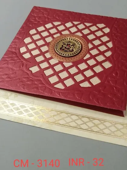 A bold red invitation with a textured finish and a central gold emblem inside a lattice window. The design is rich, traditional, and perfect for a grand announcement.