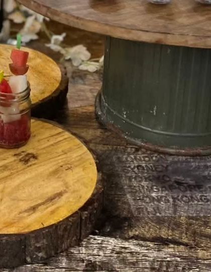 A rustic and charming dessert setup featuring fresh fruit parfaits. We use natural wood elements to create a warm and inviting display for our sweet treats.