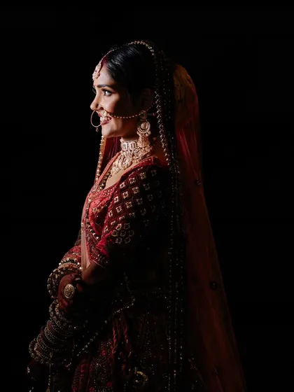 A dramatic and artistic bridal portrait. Using shadows and a single light source, I created this stunning rim-lit profile of Nikita, highlighting her silhouette against the darkness.