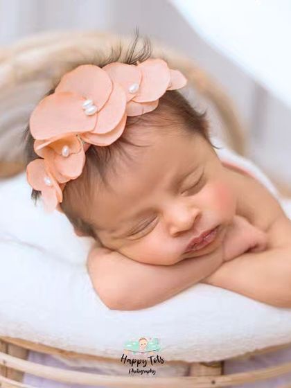 We love using different textures and props. This newborn is nestled in a soft basket with a simple wrap, a classic setup for a timeless newborn photograph.