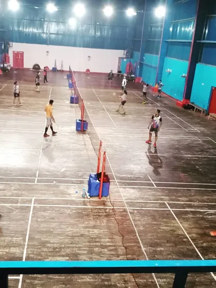Here is another angle of my busy badminton arena during a tournament. The layout of the courts is designed for efficient match flow and a great viewing experience for everyone involved.