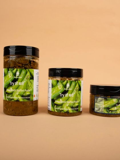 A lineup of three different sizes of the Green Chilli Stuffed Pickle.