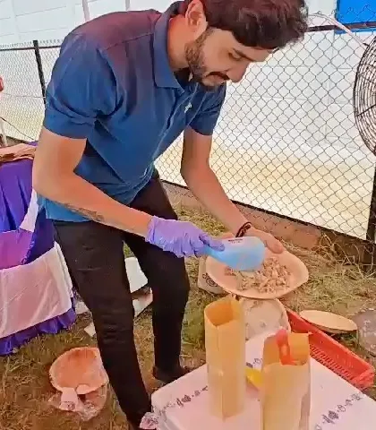 Our team member serving up fresh meals to a hungry pup at the Fur Utsav. We love seeing those tails wag.