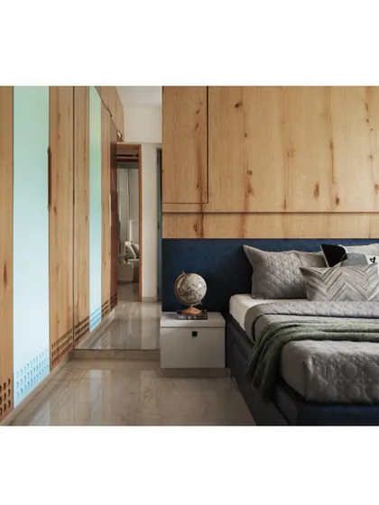 A view of the teenager's bed and wardrobe, showing the reflection in the mirror which adds depth to the space.