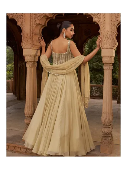 The back of this beautiful gown showcases its flowing silhouette and delicate strap details. It’s a look that is as captivating from the back as it is from the front.