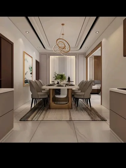 A perspective view showing the flow from the kitchen to the dining area in one of our projects. The design ensures a seamless transition between spaces, making it ideal for modern family living and entertaining guests.