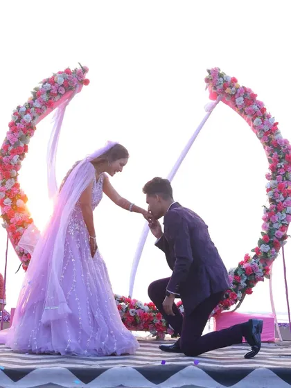 A beautiful beachside proposal with a stunning floral arch. We help you plan and capture these once-in-a-lifetime moments, ensuring your engagement photos are as breathtaking as the proposal itself.