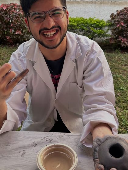 Even scientists need to get a little messy. A research scholar from Tata Memorial Centre having a blast during our outdoor pottery workshop, trading his lab coat for clay-covered hands.