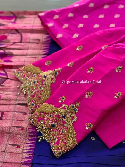 Pink sleeves with heavy zardosi cuffs in shades of gold and blue.