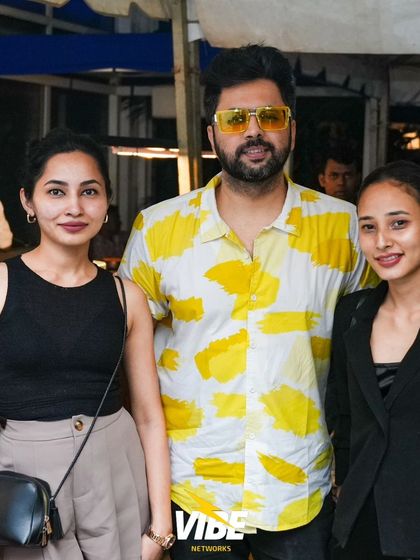 The DJ poses with guests, highlighting the friendly and interactive atmosphere we cultivate at our events.