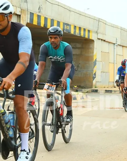 Masters category riders navigate an underpass. The varied terrain of our courses keeps the racing dynamic and unpredictable.
