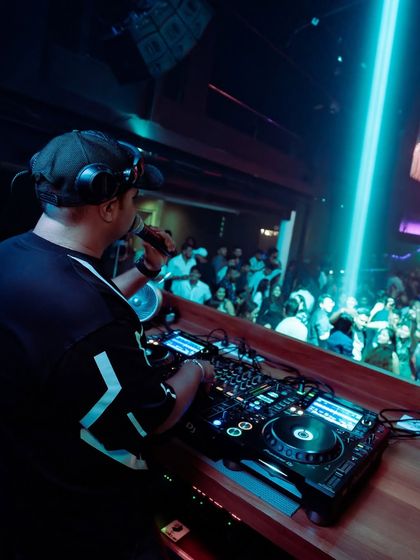 On the mic, interacting with the packed club in Goa.