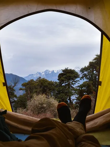 Relaxing with your feet up, looking out from the tent at a stunning view of snow-capped peaks through the trees. It’s in these quiet, comfortable moments that you can truly appreciate being in nature.