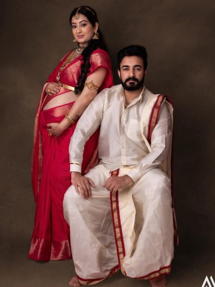 A classic portrait of the happy couple, eagerly awaiting their new arrival.