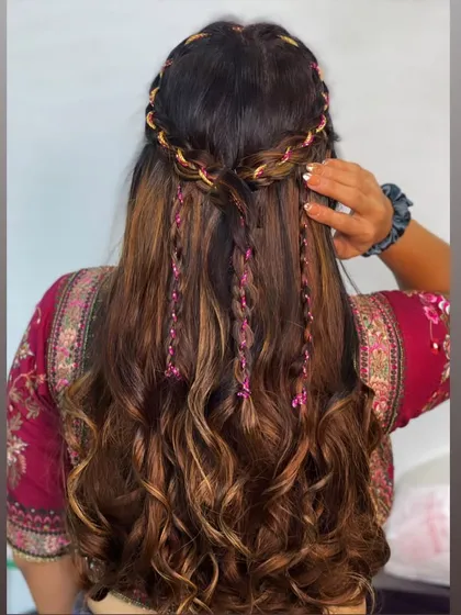 The back view of the ribbon and braid hairstyle, a perfect look for a Mehendi.